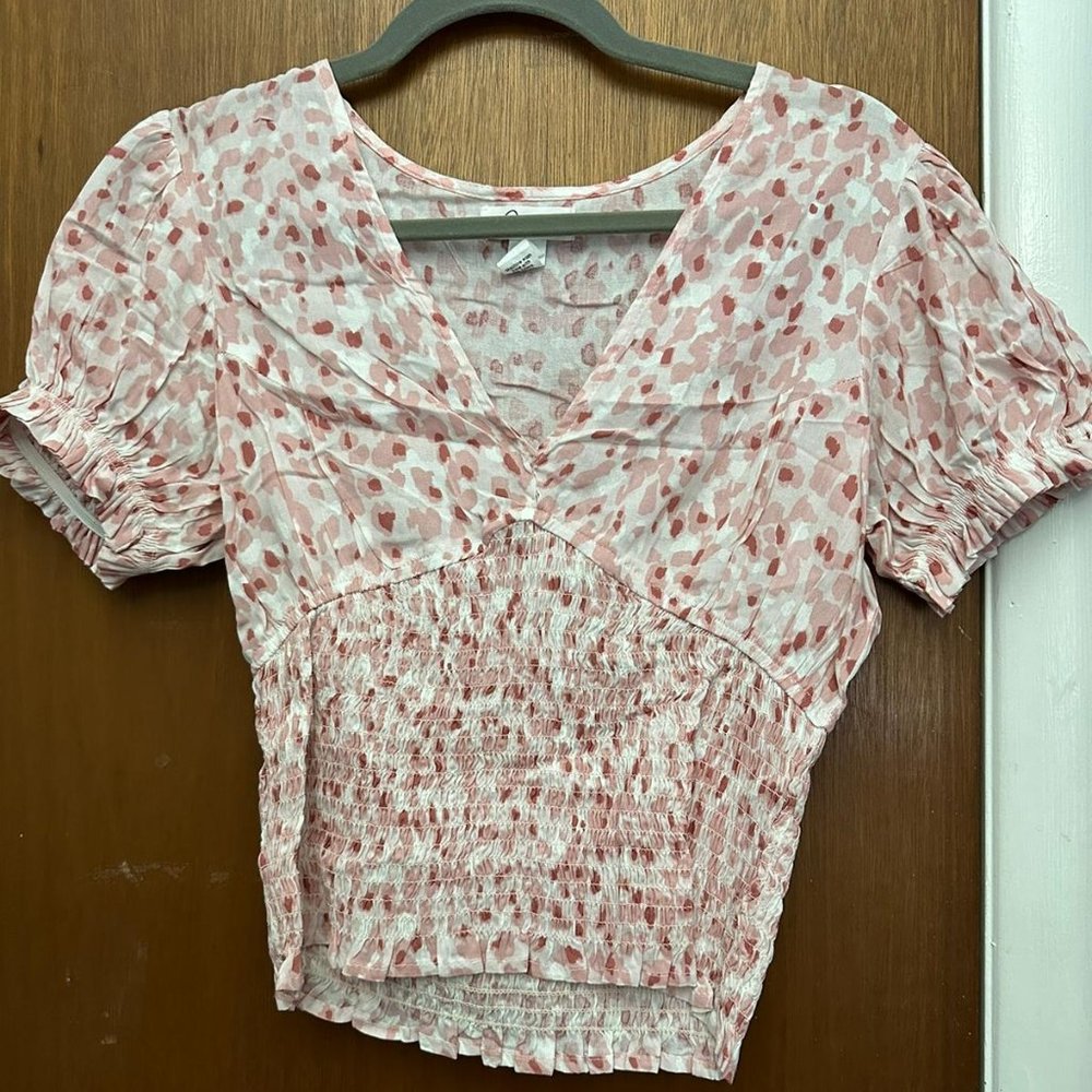 white and pink floral blouse
